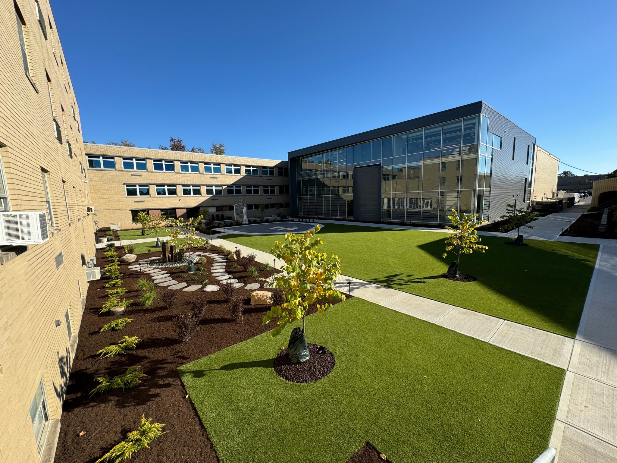Large courtyard turf installation completed by Motz Turf Farms