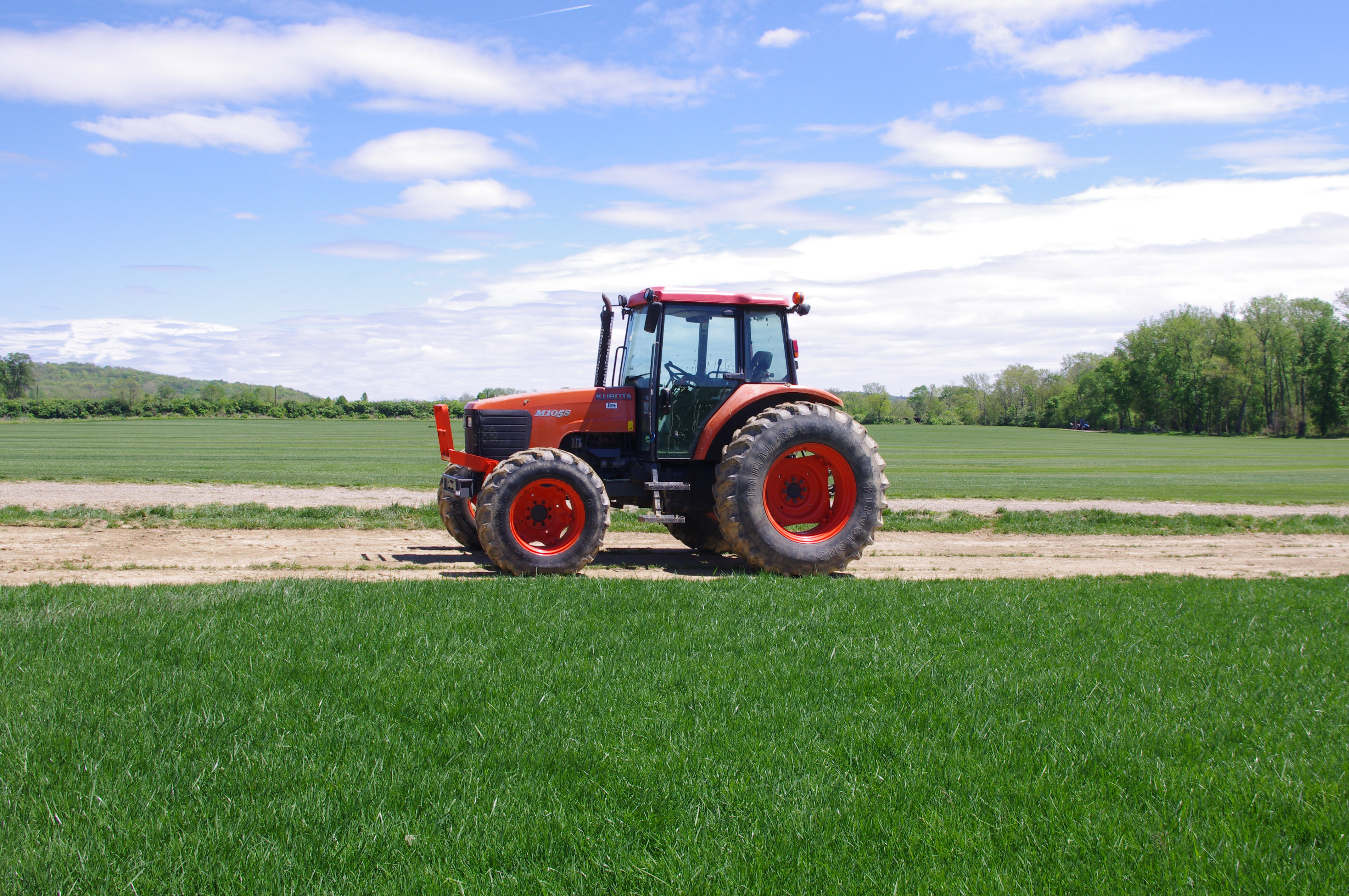 Motz tractor working across a cultivated turf field