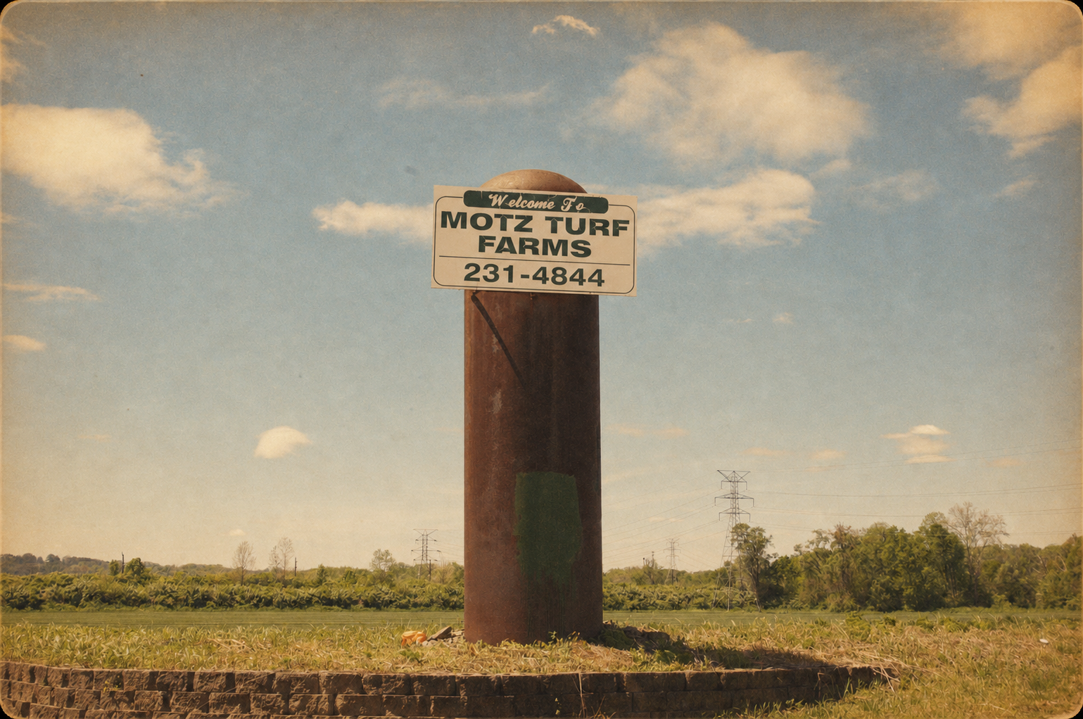 Vintage Motz Turf Farms roadside sign overlooking the farm